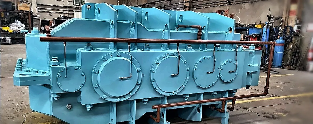 Mill gearbox in the workshop, lubrication pipes visible